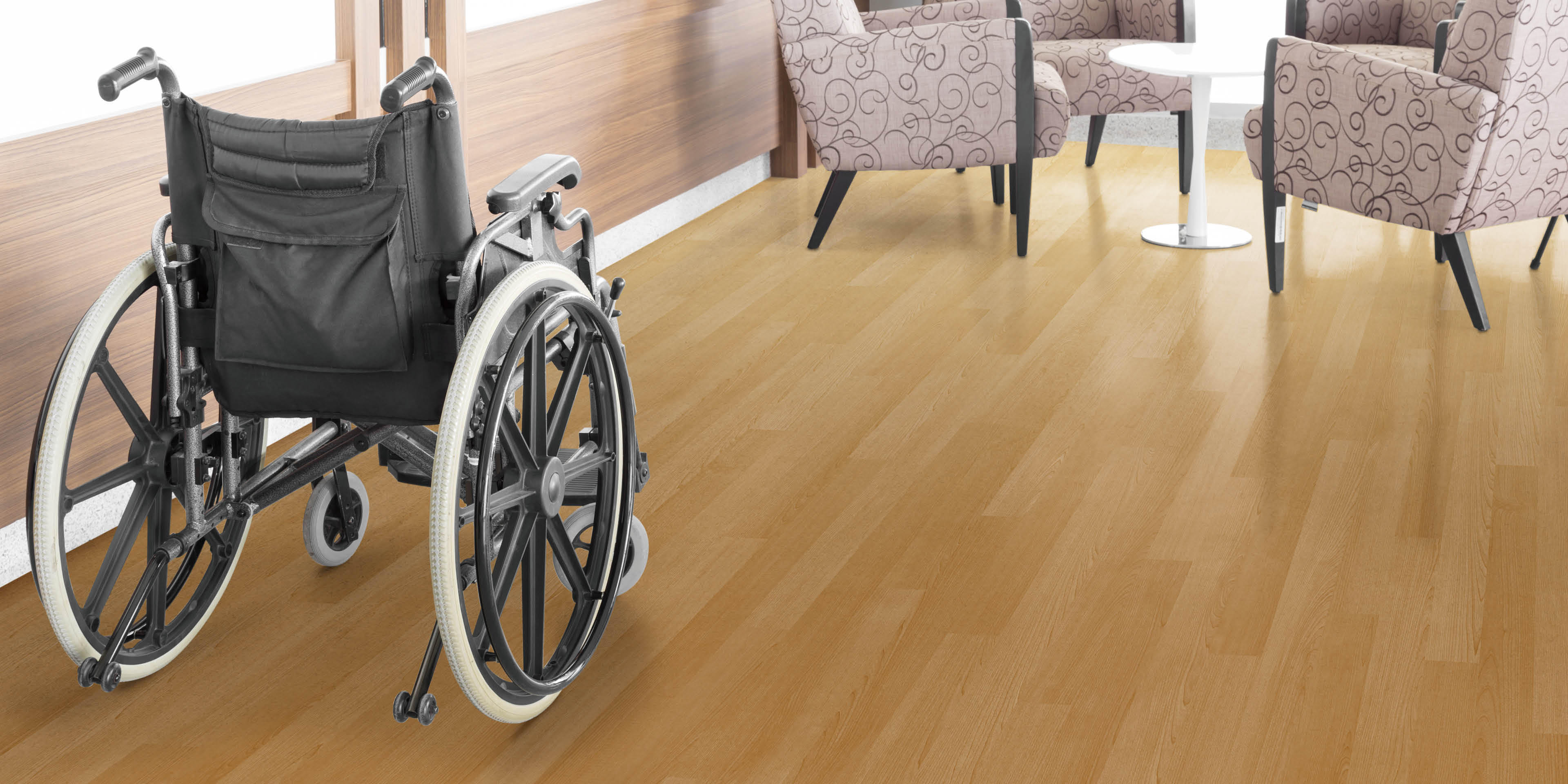 Empty wheelchair parked in hospital hallway