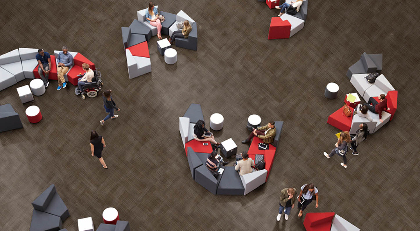Students in the atrium of modern university, elevated view